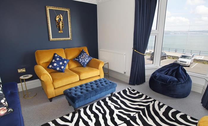 situated on the first floor with sea views. 2 sofas. TV and beanbag